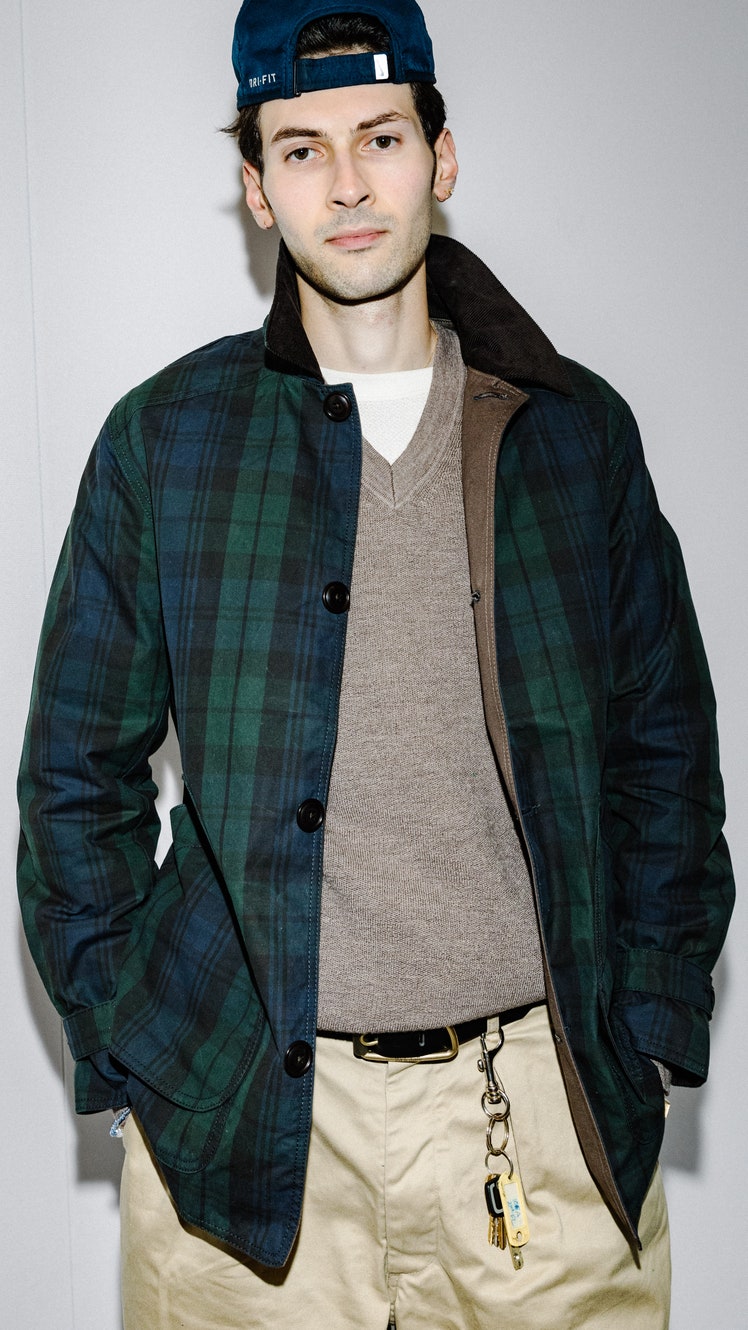 Image may contain Clothing Coat Jacket Blazer Vest Shirt Baseball Cap Cap Hat Adult Person Accessories and Belt