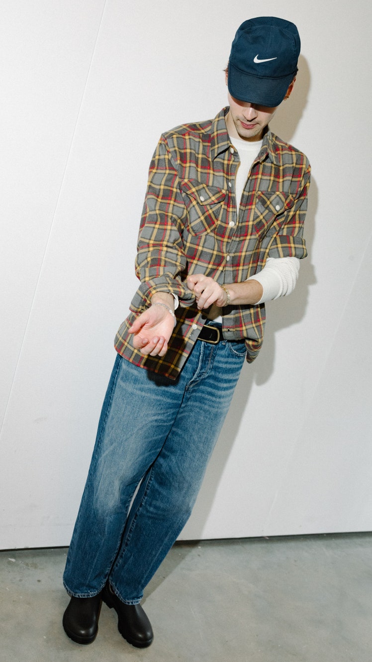Image may contain Clothing Pants Jeans Hat Adult Person Footwear Shoe Cap Face Head Photography and Portrait