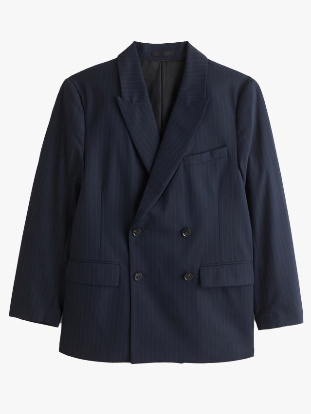 Image may contain Blazer Clothing Coat Jacket Formal Wear and Suit