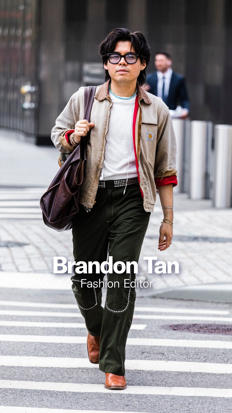 Image may contain Clothing Coat Jacket Pants Accessories Bag Handbag Person Walking Adult Glasses and Blazer