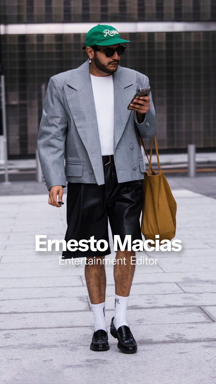 Image may contain Blazer Clothing Coat Jacket Shorts Formal Wear Suit Baseball Cap Cap Hat Accessories and Bag