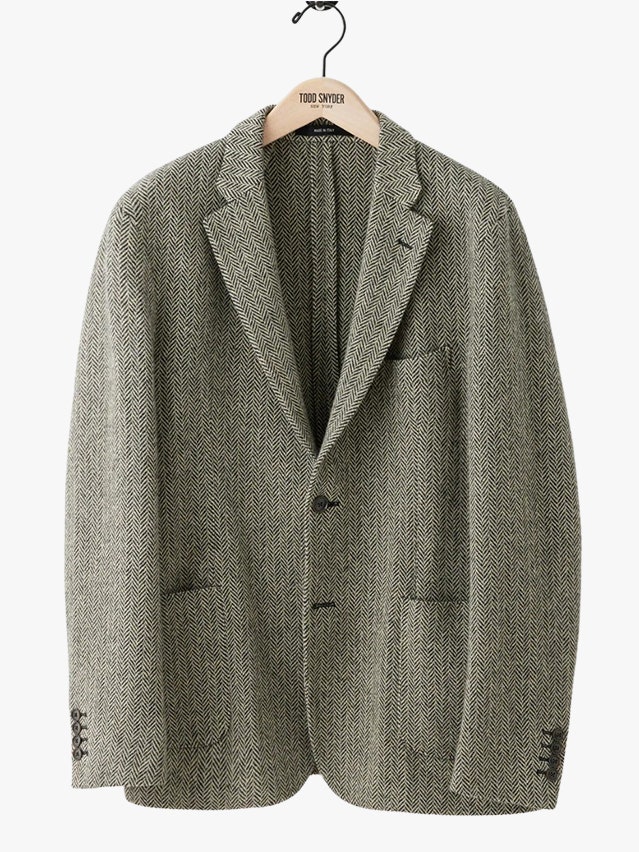 Image may contain Blazer Clothing Coat Jacket Formal Wear and Suit