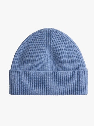 Image may contain Clothing Hat Cap Beanie Knitwear and Sweater