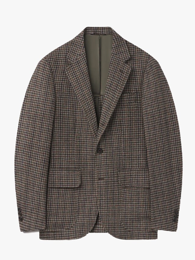 Image may contain Blazer Clothing Coat Jacket Formal Wear and Suit