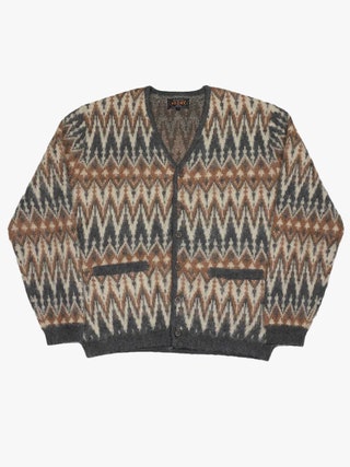 Image may contain Clothing Knitwear Sweater Coat Jacket and Blouse